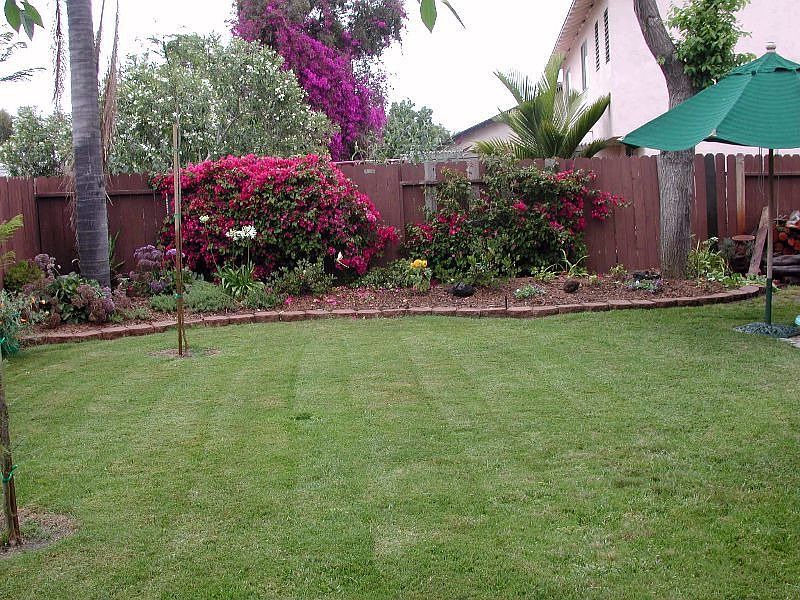 large rear yard w/ auto sprinklers