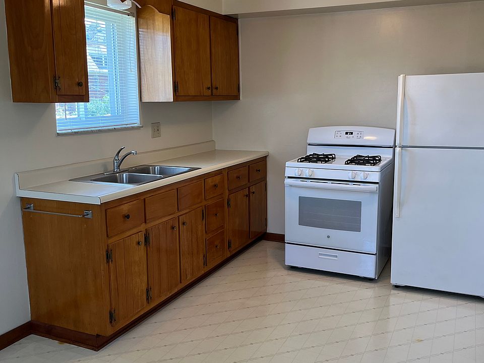 Kitchen is furnished with newer refrigerator and stove. Can accommodate a dining set.