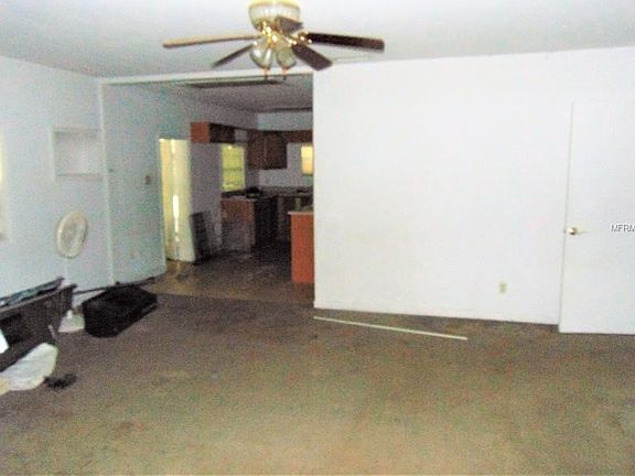 View towards kitchen and side carport entrance