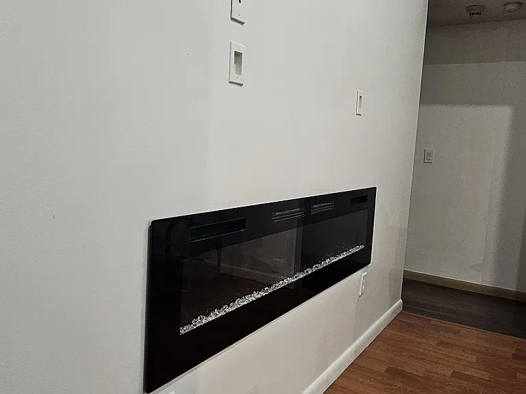 Built in electric fireplace in living area