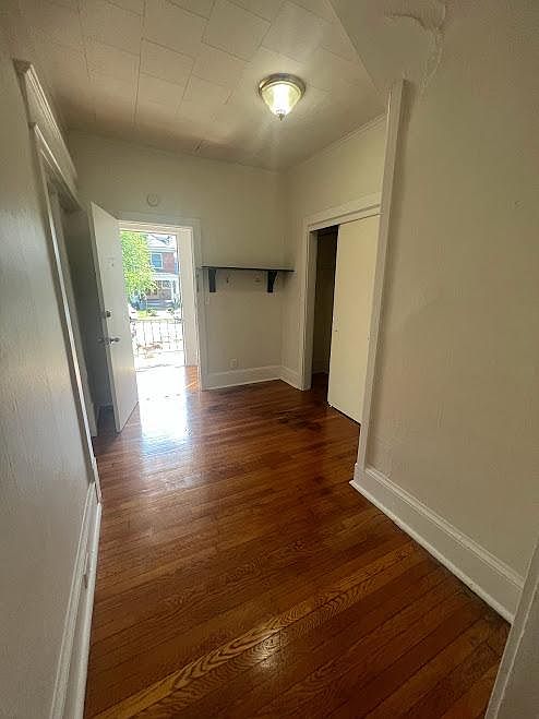 looking back from foyer, apartment door open, exterior door open
door to left = bedroom 1
door to right = closet