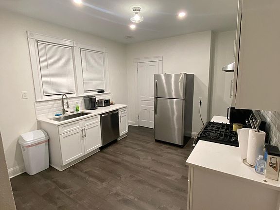 Updated kitchen, including newer appliances, quartz counters, subway tile backsplash