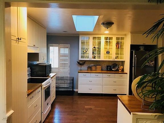 Kitchen designed with maximum storage and hickory flooring