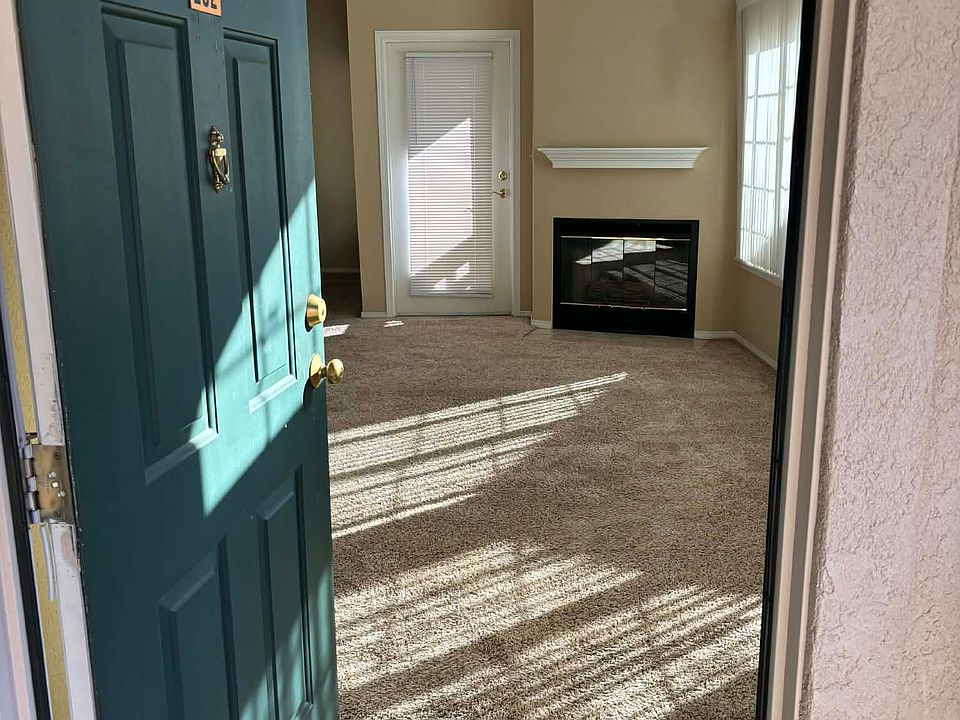 Front door entry showing the fire place and the door to the private patio.