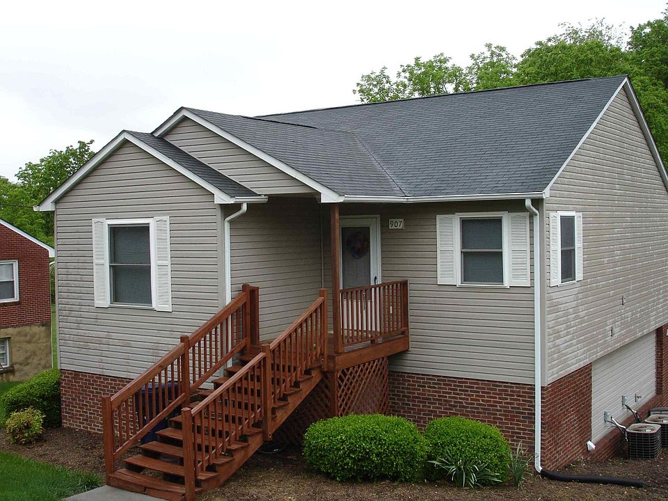 Outside of building, ample parking and lots of green space!