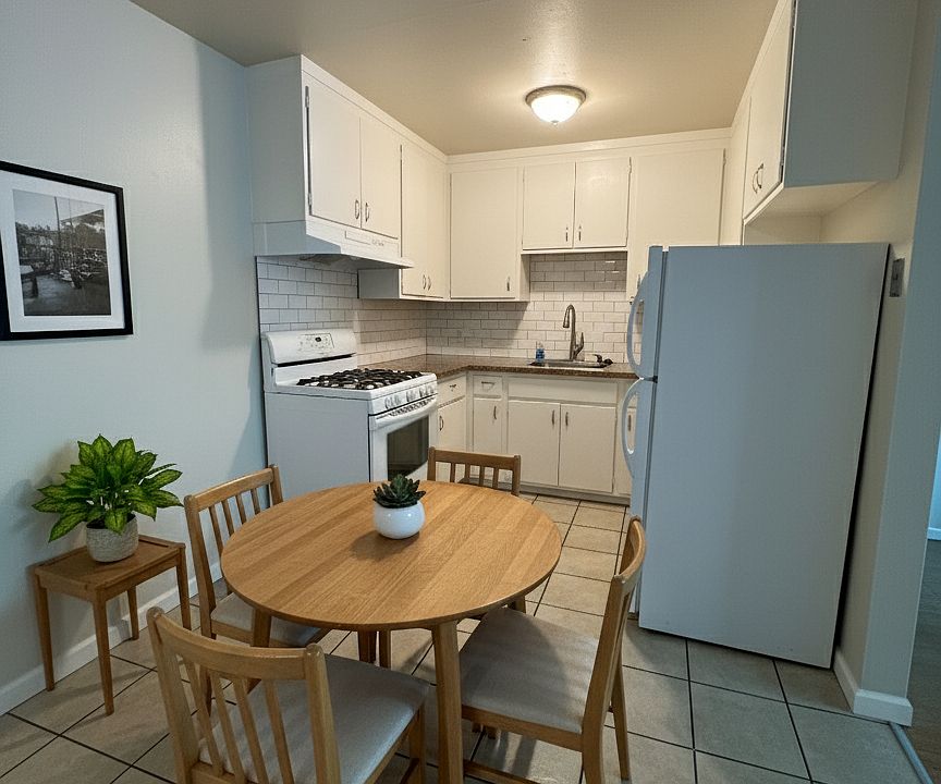 Kitchen of the 2BR unit, but seen with furniture