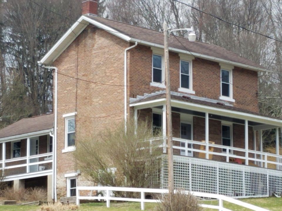Farmhouse. New windows, large front porch.