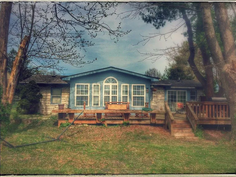 The expansive patio and large backyard are ideal for enjoying outdoors.