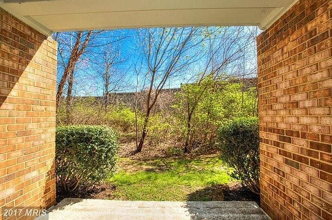 Garden level entrance on end unit and open green area