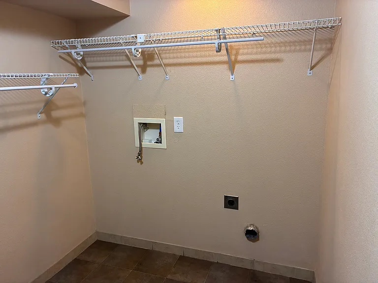 Laundry area with appliance hookups.
