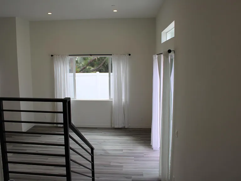 landing as you look into the living room the half bath is to the left and to the right is the front door