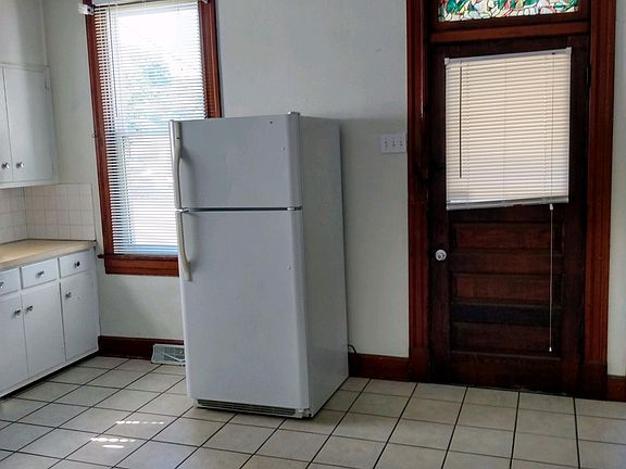 VERY SMALL LANDING IN REAR. REFRIGERATOR