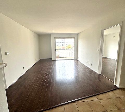 Bright living room with large bedrooms on either side for privacy.