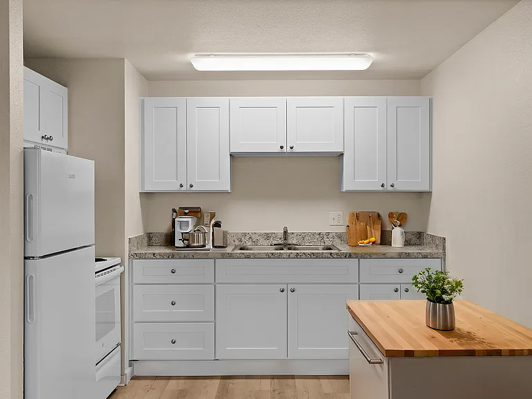 Experience culinary delights in this stylish kitchen with modern amenities.