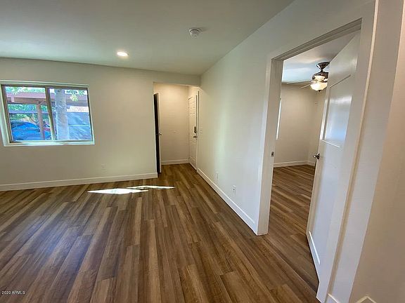 View of the front door and bedroom door