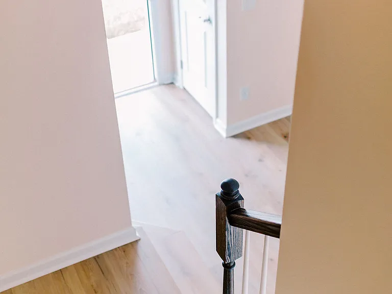 Looking down from 1st-to-2nd floor stairs.