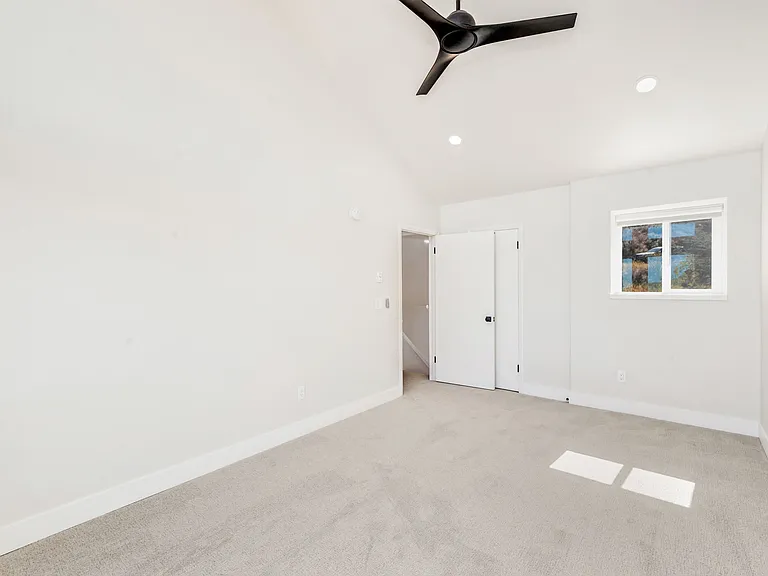 Bedroom #2 - on upper level. Floor to ceiling windows with electric black out window shades.