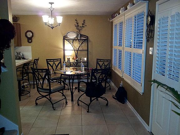 DAILY DINING, PLANTATION SHUTTERS ON ALL WINDOWS FACING THE BACK YARD