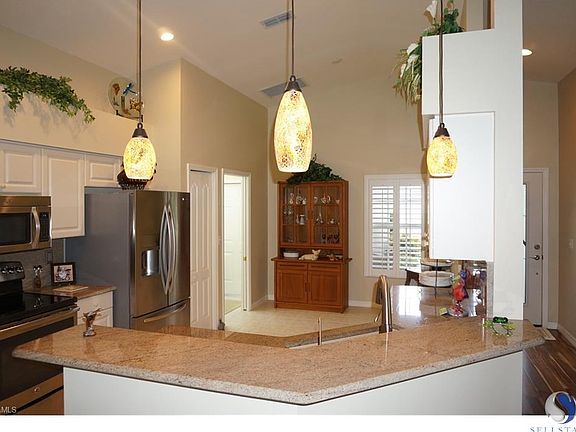 Newly remodeled kitchen with upgraded granite counter tops, stainless steel appliances, new sink, faucets and  pendant lights, freshly cleaned ceramic tile in the kitchen and rich new wood on floors and hallways. Also freshly painted throughout the house 