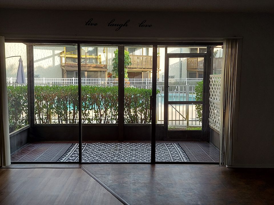 Screen room exit to pool with gate right outside screen room.