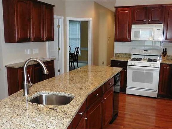 Kitchen. This is a view of the Kitchen showing the doorway to the dining room and the steps leading to the fabulous lower level.