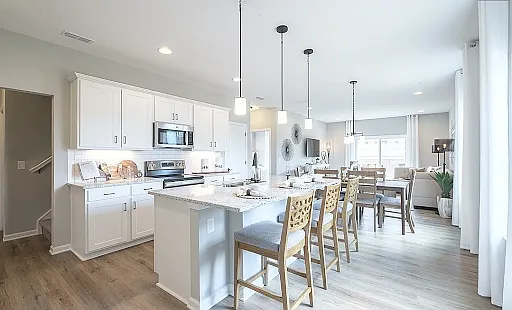 Open and airy kitchen with stainless appliances