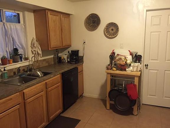 Kitchen: stove, fridge and pantry opposite