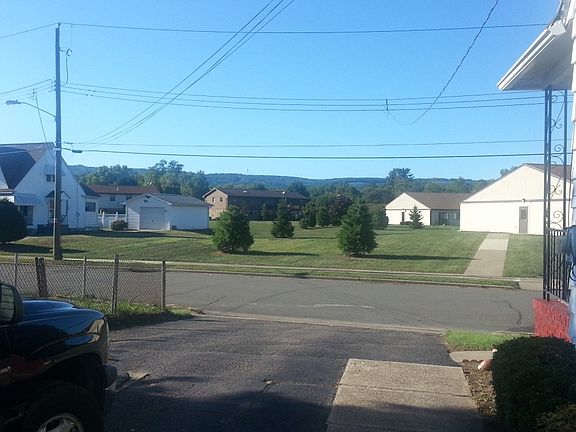 Looking out driveway from rear of house