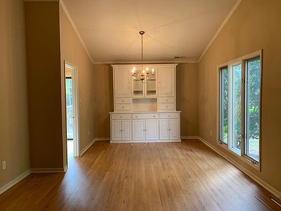 Formal dining room has a built in cabinet-great for storage.