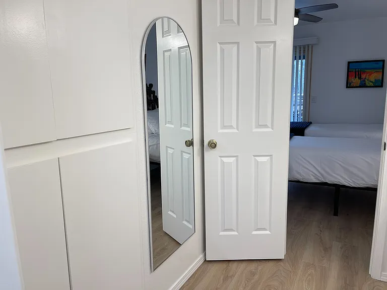 En suite bathroom to Secondary Bedroom. Built in storage, perfect for clothes that don't need to be hung.