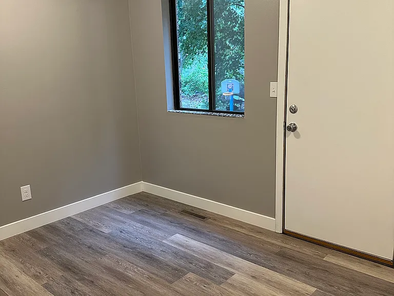 Kitchen updated townhome, door to back yard.