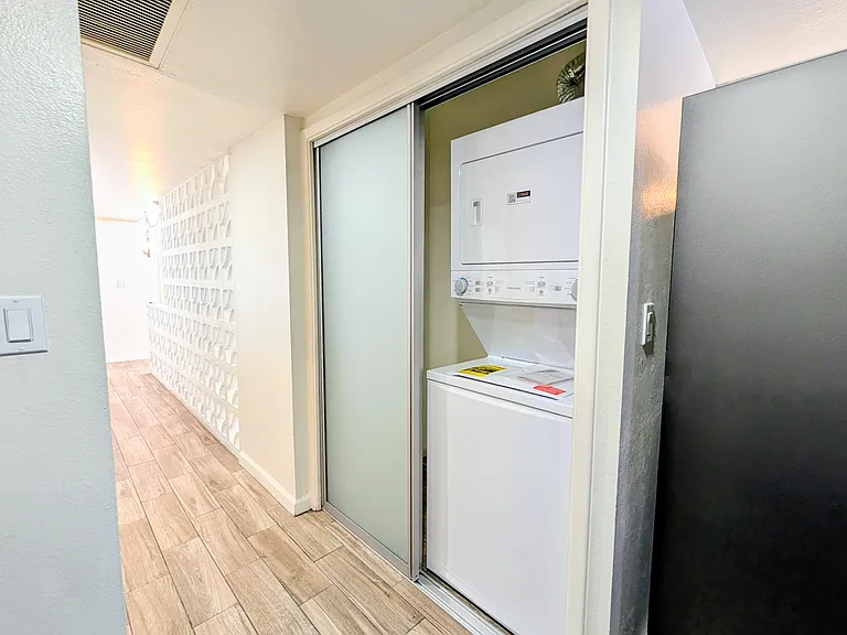 stackable washer / dryer by the kitchen