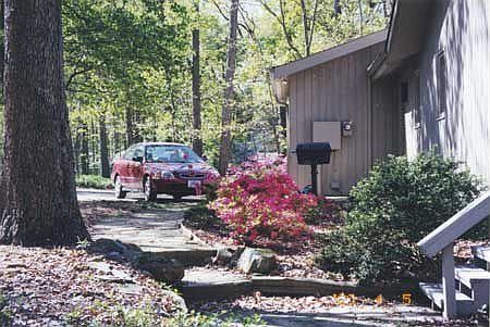 East side of house; car in front of garage
