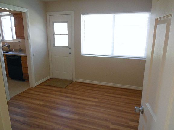 Den with new laminate wood flooring