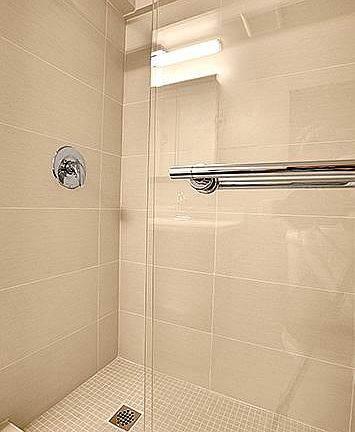 Tiled shower with glass doors