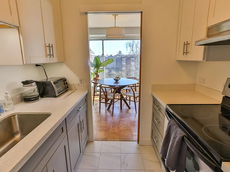 A compact but very functional cooking space, looking out on the dining room and First Hill Park.