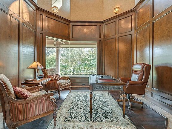 Study features extensive mill work and views of the backyard and pond.