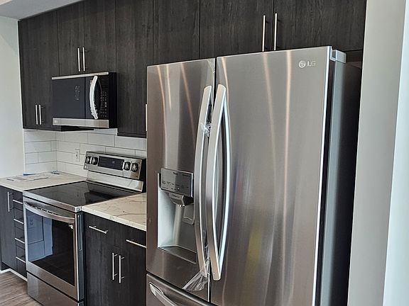 Sleek kitchen with stainless steel LG appliances