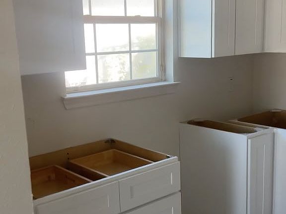 Another view of the kitchen where the sink will go overlooking a bright window to the outside.