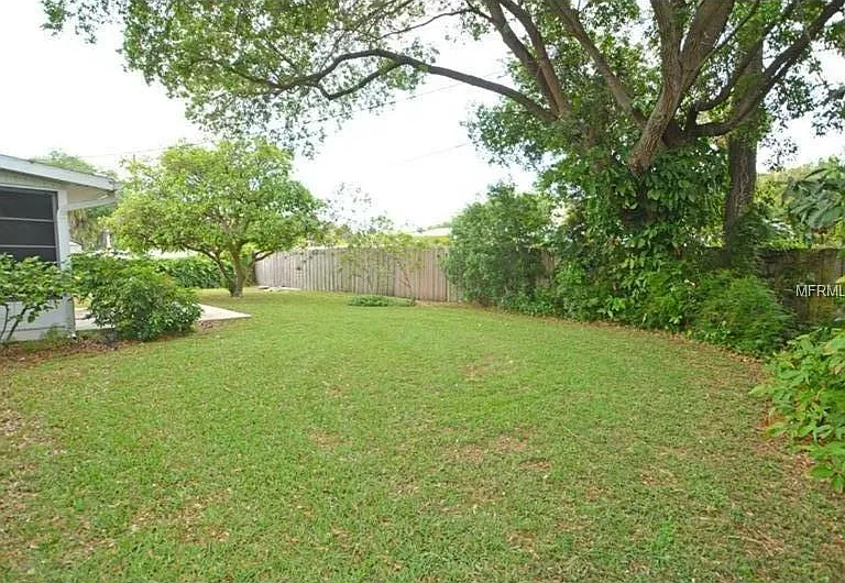Completely fenced treed back yard