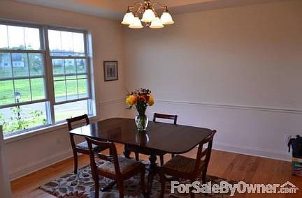 Dining Room
						:
						Hardwood Floors, Tray Ceiling, crown molding & chair rail