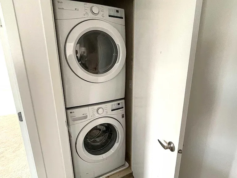 Full size washer/dryer next to bedrooms