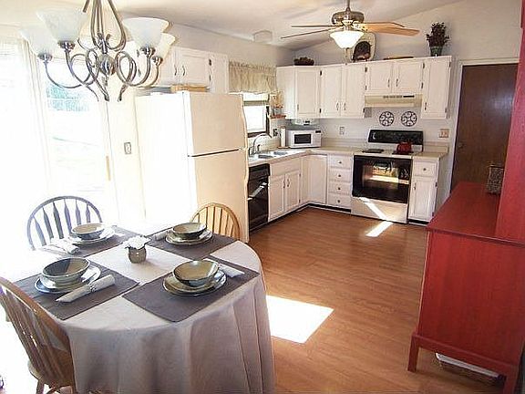 Large eat-in kitchen with sliders to back yard.
