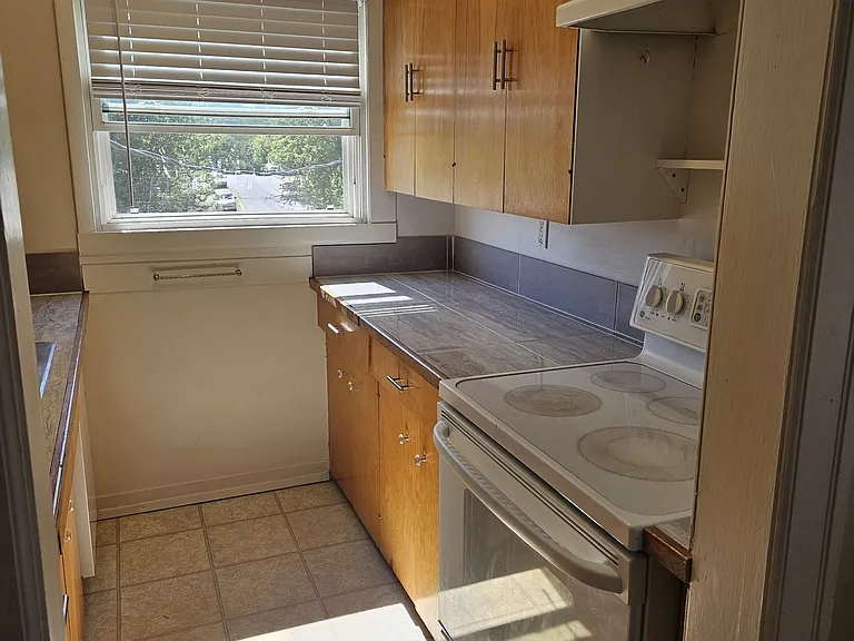 Full galley kitchen with dishwasher, light and bright!