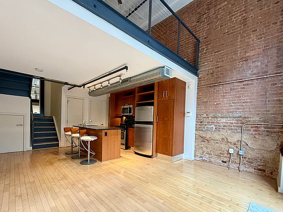First floor with options for living room, office, bar-top dining room& full kitchen.
