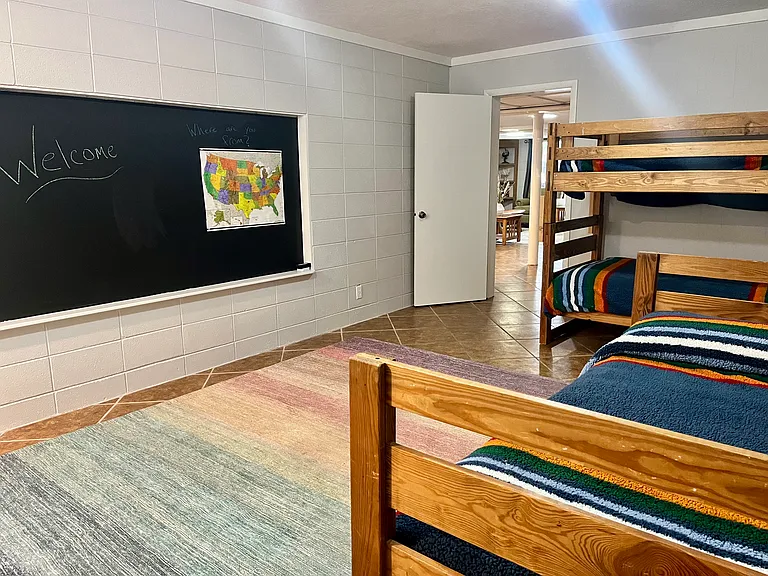 Bedroom with twin bunks and additional twin bed
