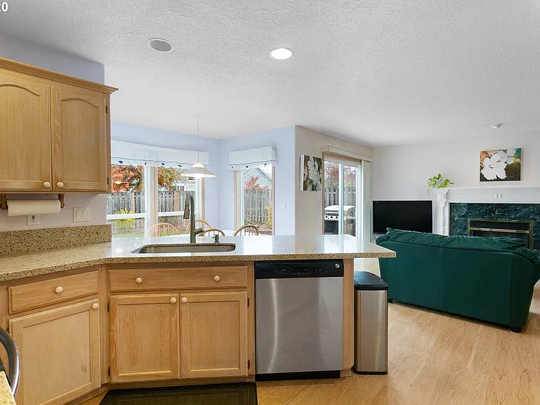 Living room 2 by kitchen with gas fireplace