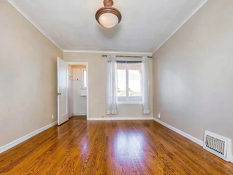 2 of 4 bedrooms with two closets and window to 2nd floor deck. House will be delivered unfurnished.