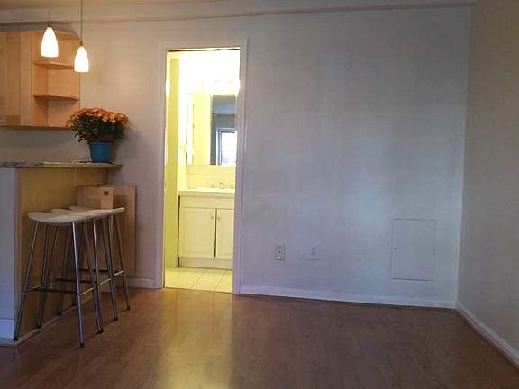 Living area toward kitchen and bath.