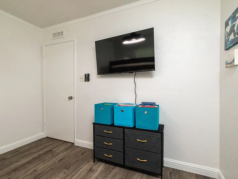 Bedroom 2 features a bunk bed with a double bed and single bed on top as well as flat-screen Roku TV, children books and kids games, perfect for the kiddos! There is also a spacious closet with a luggage rack and hangers for plenty of storage.